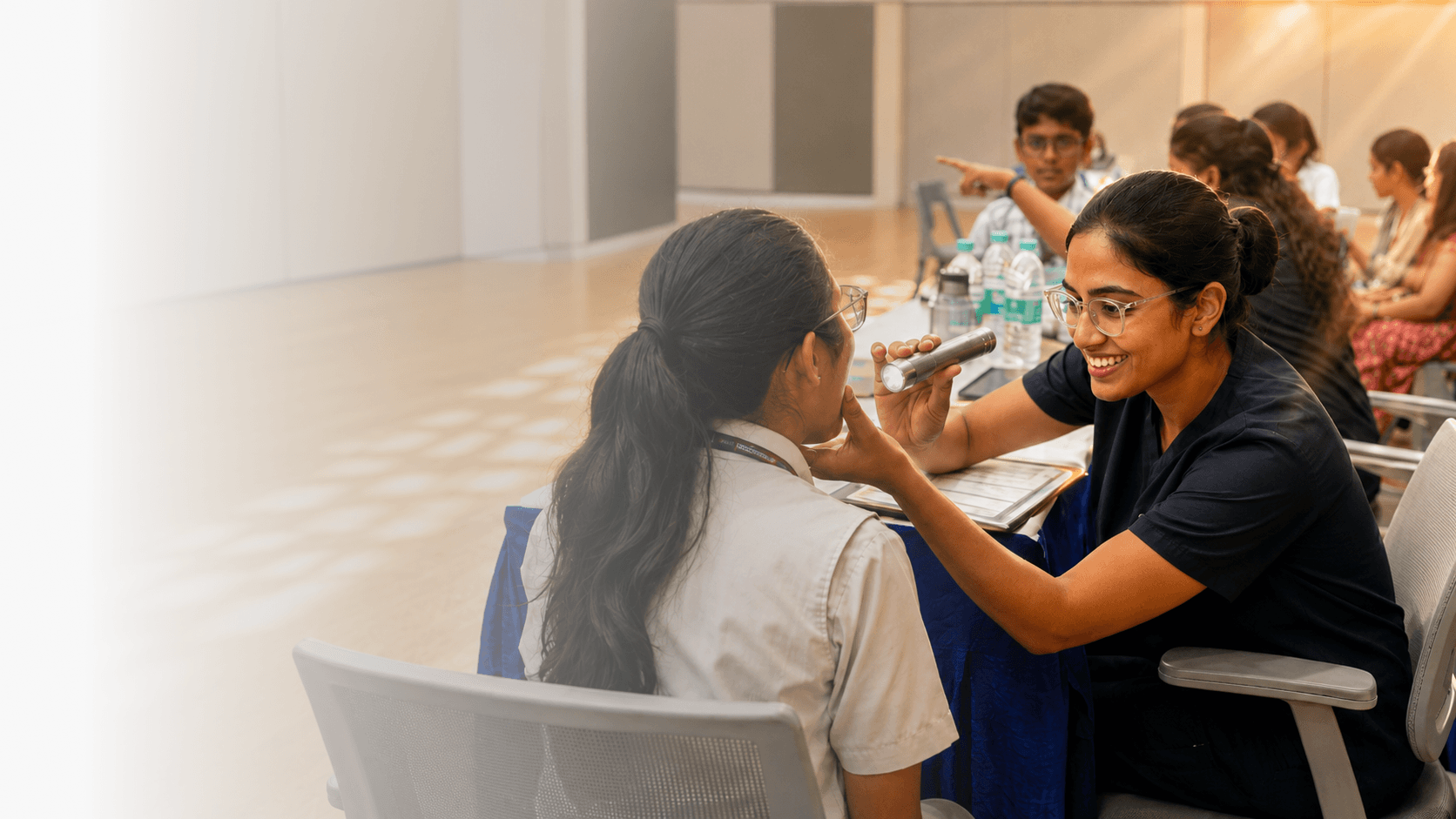Apollo SHINE nurse examining a student
